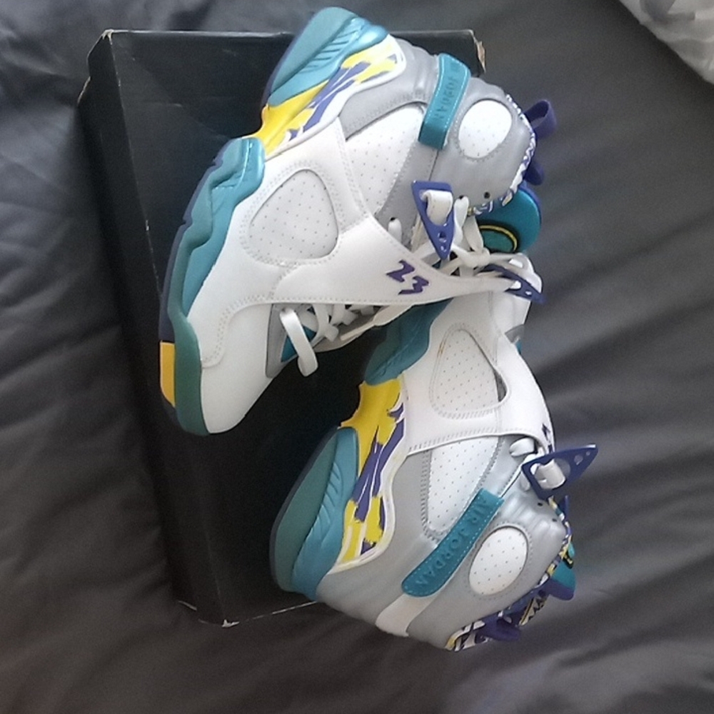 White and Teal Sneakers with Yellow Accents